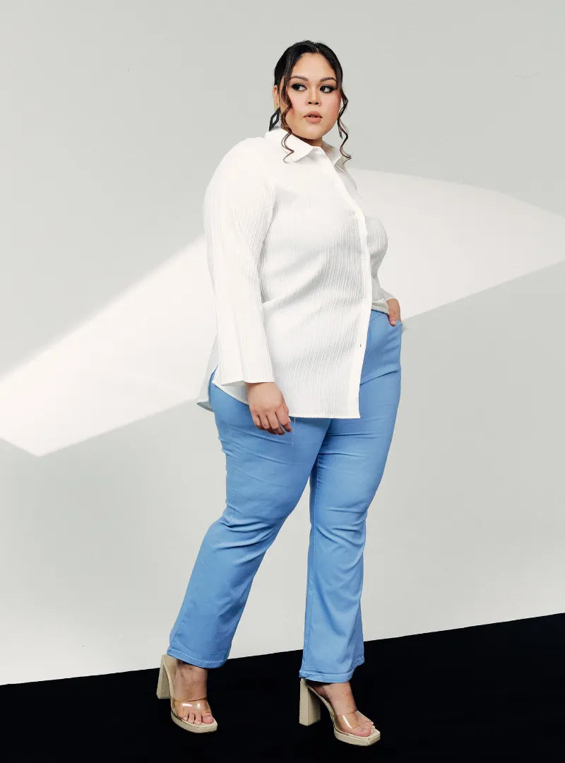 A woman wearing Mid Blue Ms Nadia Bootcut Trouser