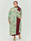 A woman dressed in Mint Flower Longline Printed Shirt Dress