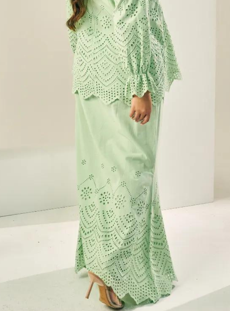 A woman wearing Mint Green Ezzah Eyelet Doll Skirt