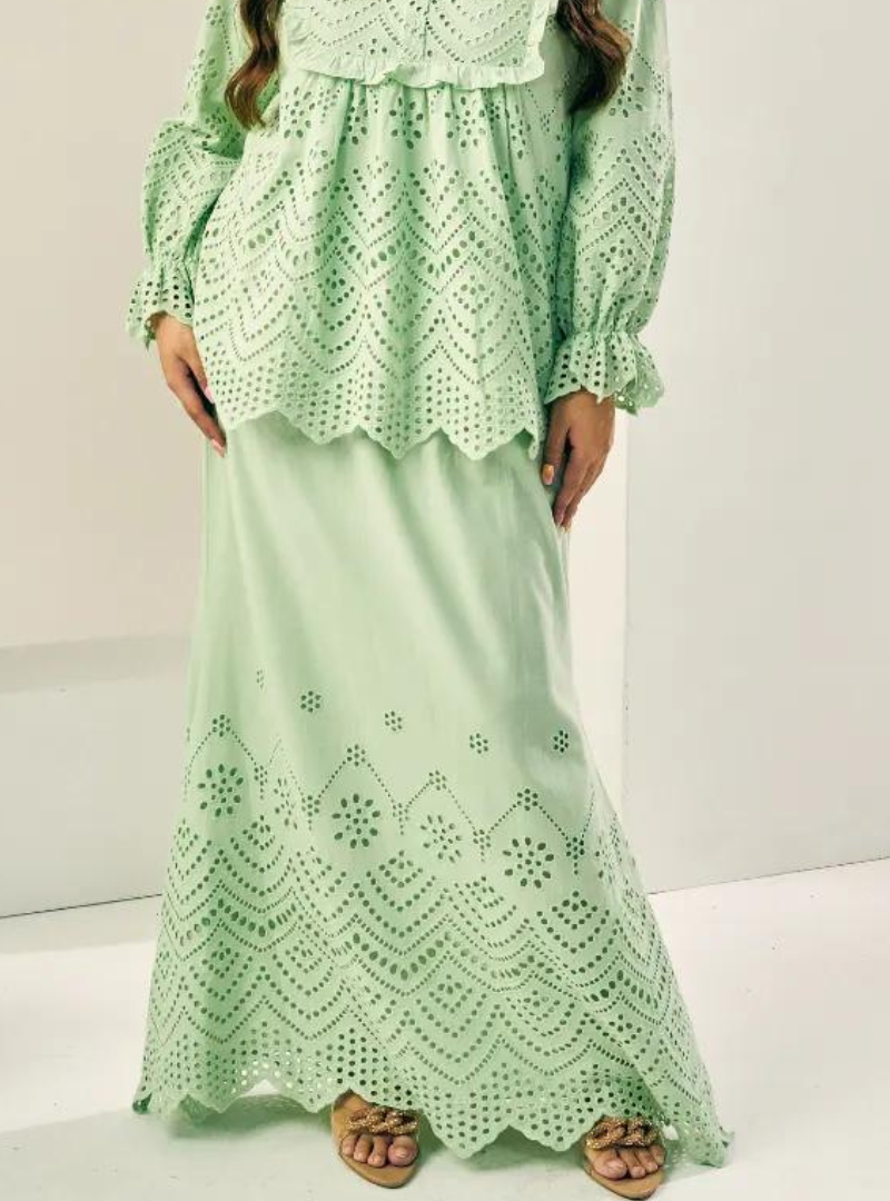 A woman wearing Mint Green Ezzah Eyelet Doll Skirt