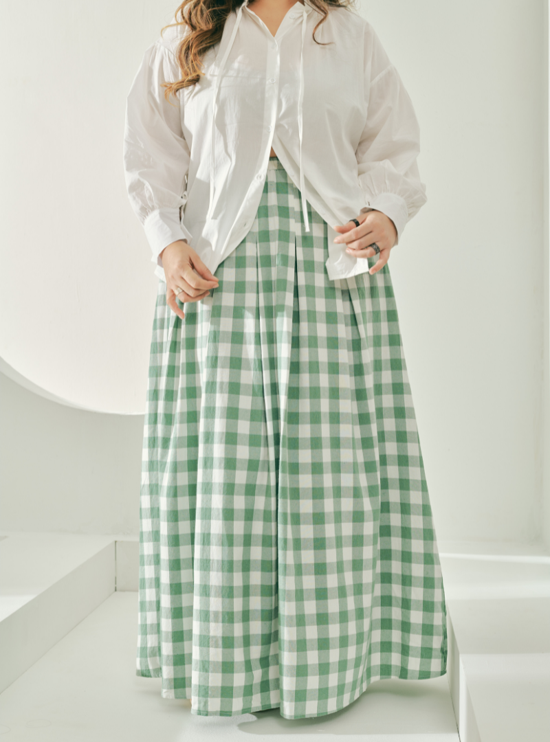 A woman wearing Mint Green Jane Checked Skirt