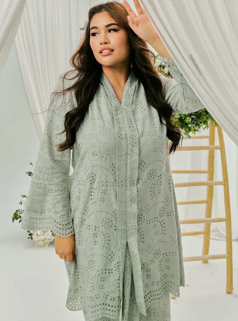 A woman dressed in Mint Green Tun Sabrina Eyelet Kebarung