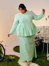 A woman dressed in Mint Green Tun Zera Eyelet Kurung