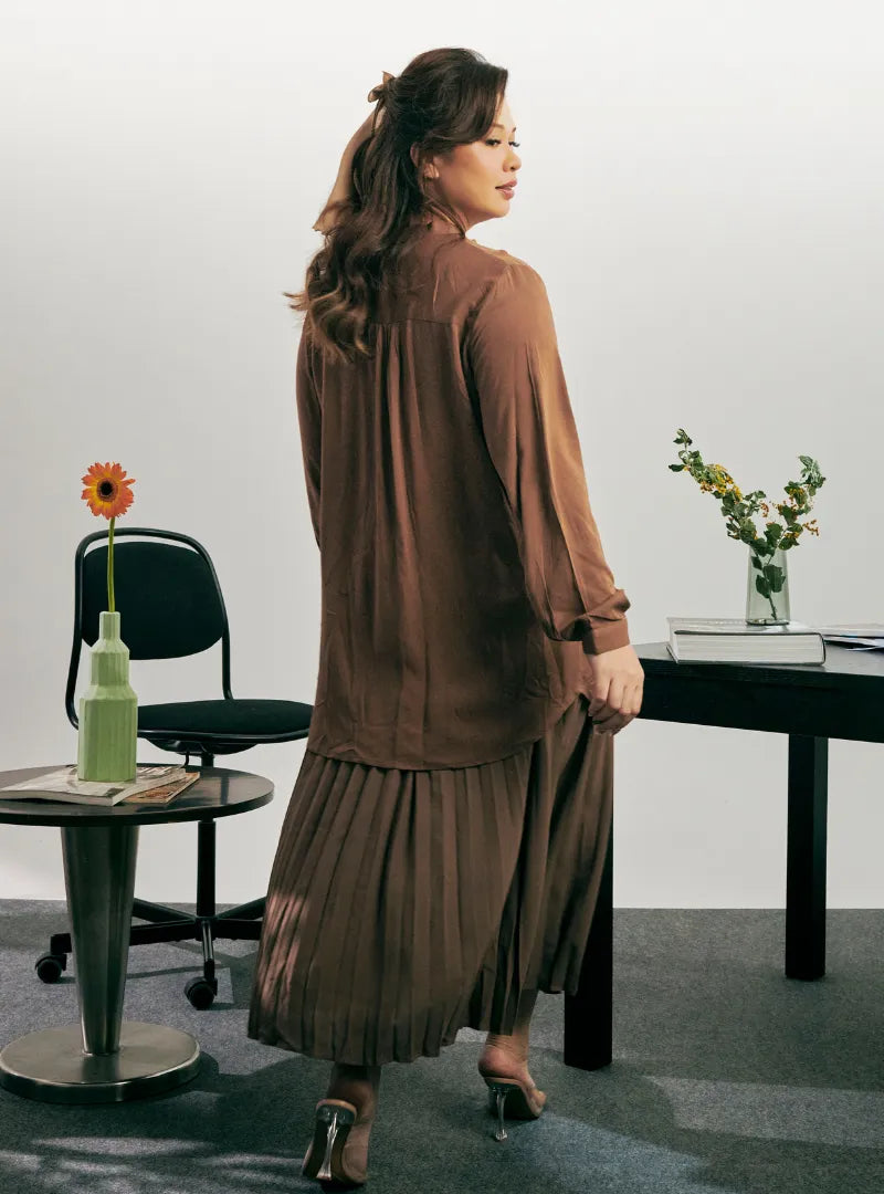 A woman dressed in Mocha Jolin Mandarin Collar Shirt