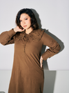 A woman dressed in Mocha Marsya Cotton Long Sleeve Dress