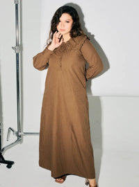 A woman dressed in Mocha Marsya Cotton Long Sleeve Dress