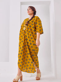 A woman dressed in Mustard Daisy Essential Front Knot Printed Light Cotton Dress