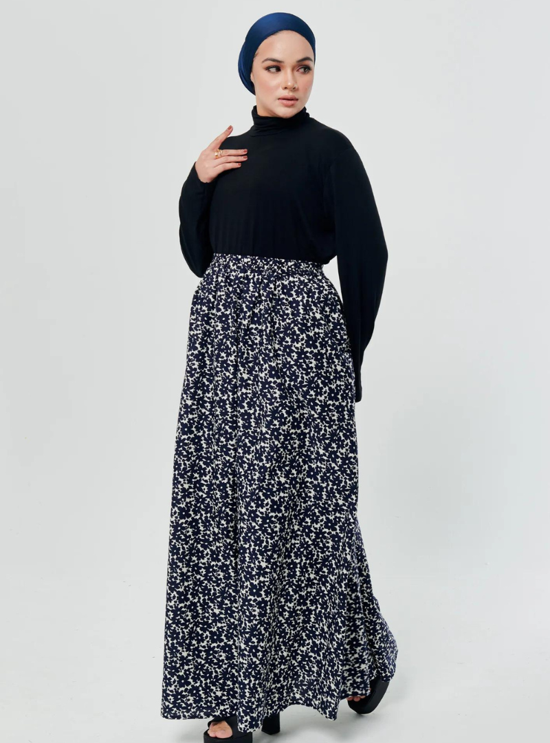 A woman wearing Navy English Printed Cotton Maxi Skirt