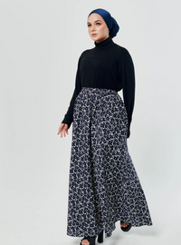 A woman wearing Navy English Printed Cotton Maxi Skirt