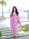 A woman dressed in Dusty Pink Nelydia Pario Wrap Only