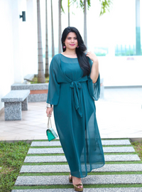 A woman dressed in Emerald Green Nelydia Pario Wrap Only