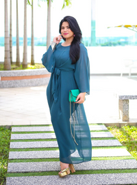 A woman dressed in Emerald Green Nelydia Pario Wrap Only