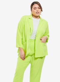 A woman dressed in Neon Green Oversized Blazer
