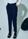 A woman wearing in Navy Blue Audrey Skinny Slacks