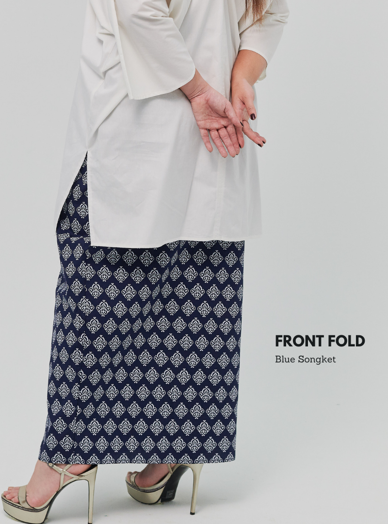 A woman dressed in Navy Songket Front Fold Songket Skirt