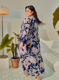 A woman dressed in Navy Tun Anum Printed Wrap Kurung