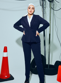 A woman wearing in Navy Blue Amber Peplum Blazer - OL Series