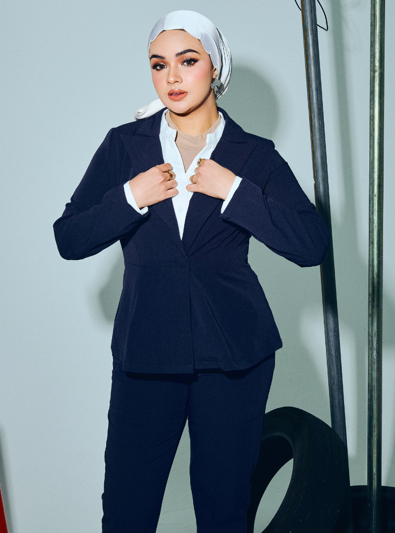 A woman wearing in Navy Blue Amber Peplum Blazer - OL Series