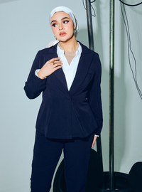 A woman wearing in Navy Blue Amber Peplum Blazer - OL Series