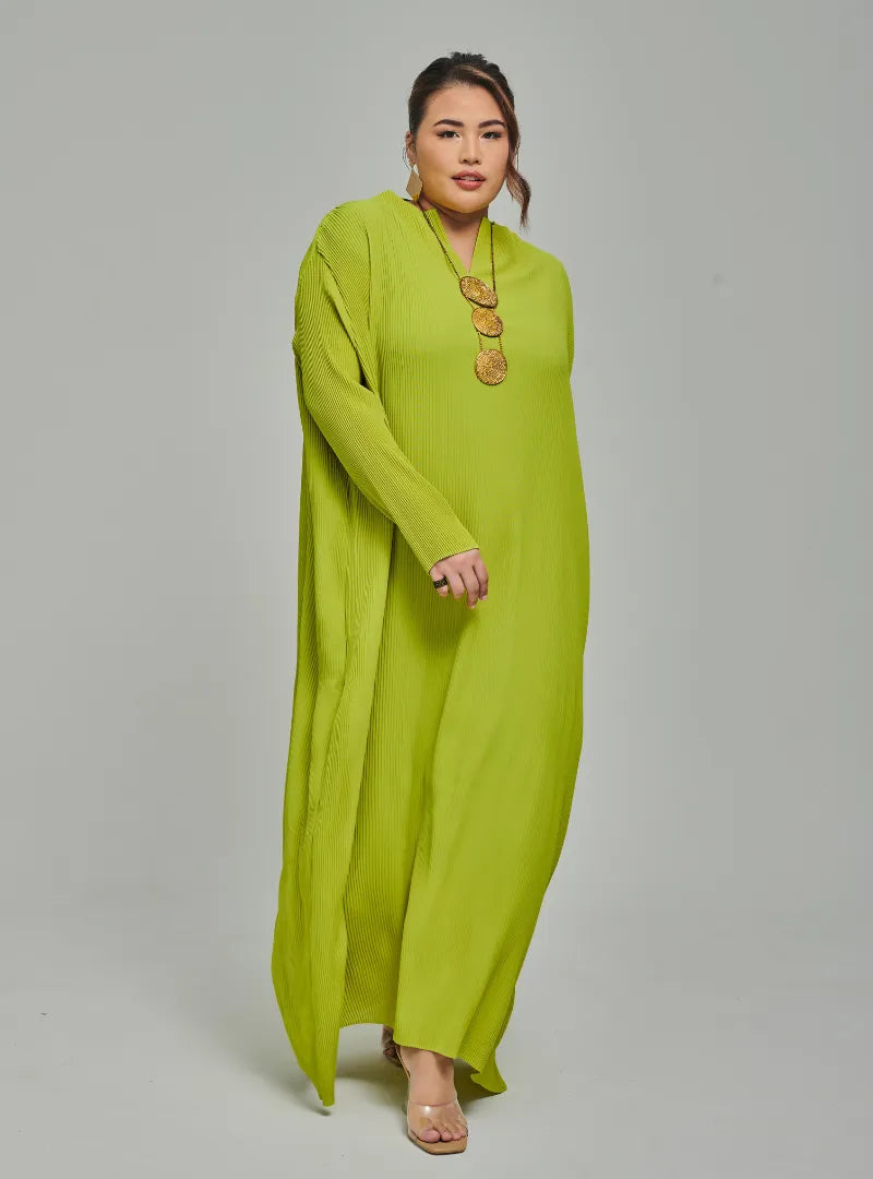 A woman dressed in Neon Green Tun Aimellia Pleated Maxi Dress