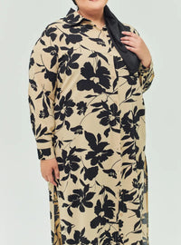 A woman dressed in Nude Lotus Longline Printed Shirt Dress