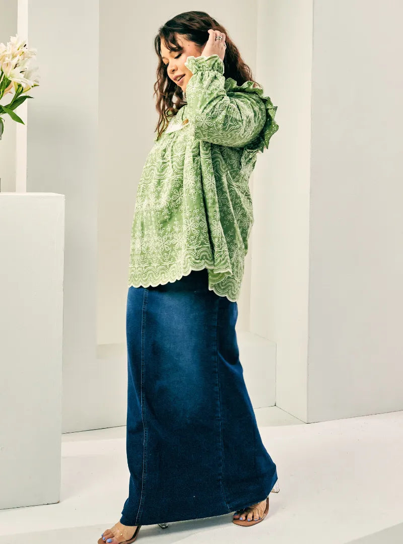 A woman dressed in Olive Miza Cotton Broderies Eyelet Top