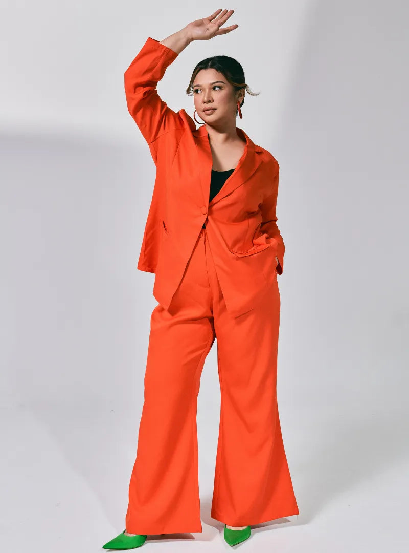 A woman dressed in Orange Lapel Collar Oversized Blazer