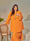 A woman dressed Orange Tun Melur Dotted Kurung Pahang-