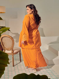 A woman dressed Orange Tun Melur Dotted Kurung Pahang-