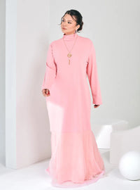 A woman dressed in Pink Ms Lana High Neck Organdy Dress