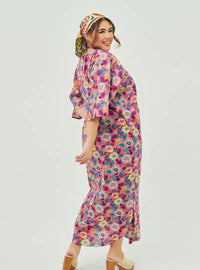 A woman dressed in Peach Garden Essential Front Knot Printed Light Cotton Dress