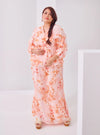 A woman dressed in Peach Tun Hamidah Chiffon Wrap Kurung