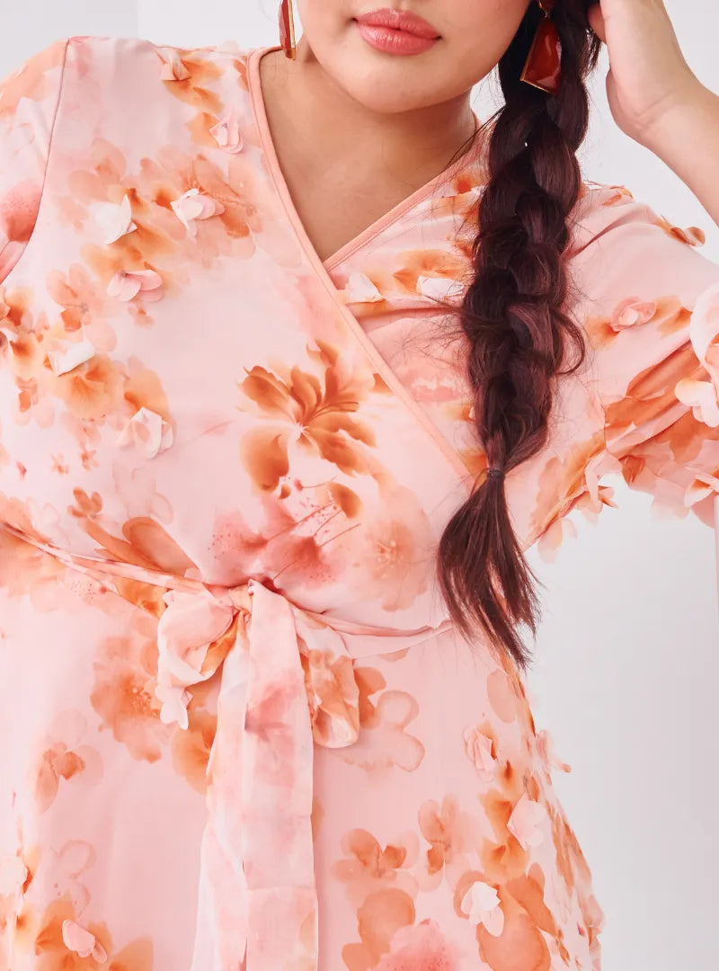 A woman dressed in Peach Tun Hamidah Chiffon Wrap Kurung