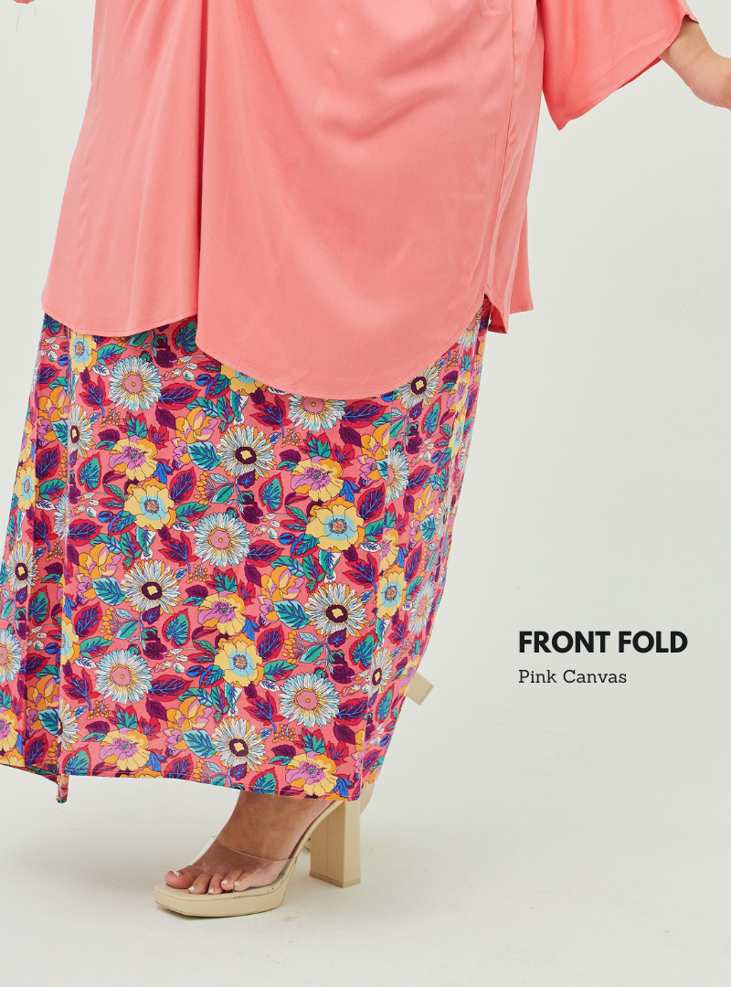 A woman dressed in Pink Canvas Front Fold Songket Skirt