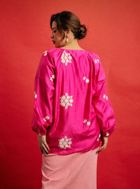 A woman dressed in Pink Goddess Wong Gu Embroidered Cheongsam Top