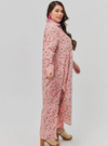 A woman dressed in Pink Jasmine Longline Printed Shirt Dress