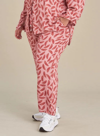 A woman wearing Pink Leaves Lounge Pants