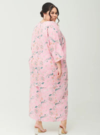 A woman dressed in Pink Ranting The Vintage Opah Kurung