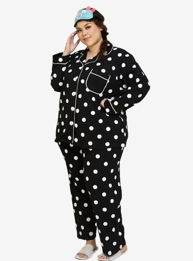 A woman dressed in Black Polka Dotted Pyjamas