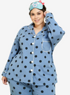 A woman dressed in Stone Blue Polka Dotted Pyjamas