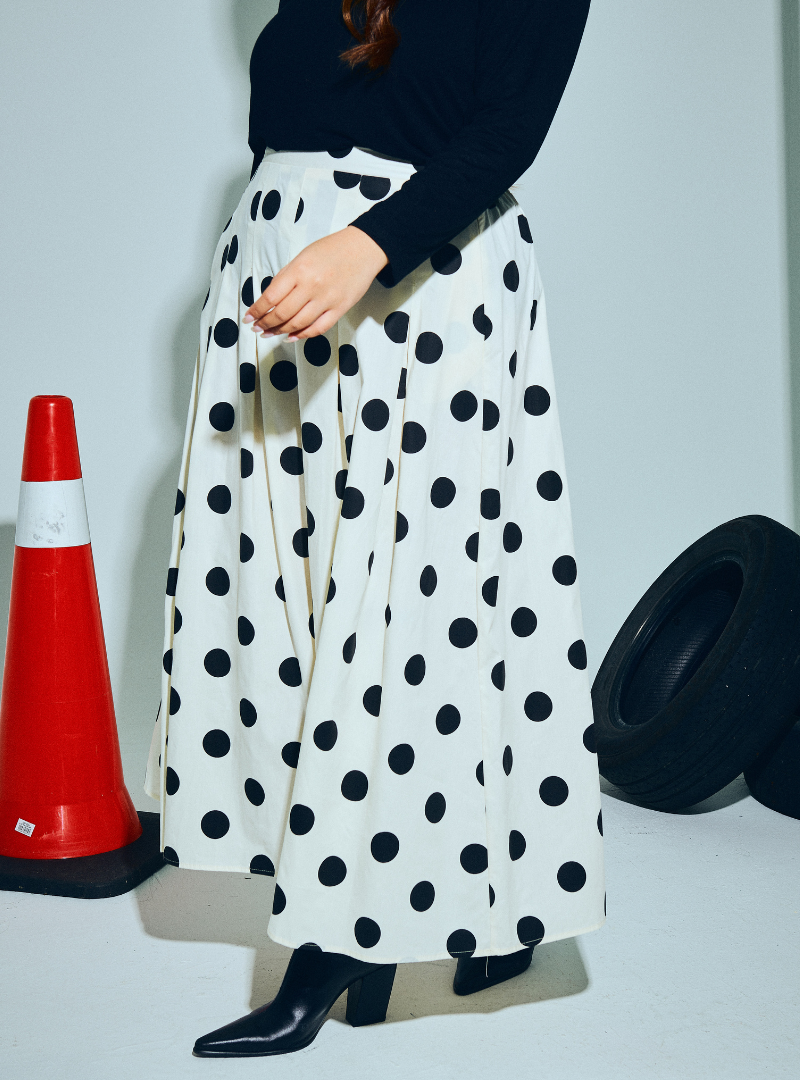 A woman wearing Black Polka Dotted