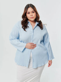 A woman dressed in Powder Blue Textured Shirt