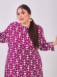 A woman dressed in Purple Daisy Premium Cotton Kurung