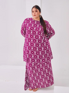 A woman dressed in Purple Daisy Premium Cotton Kurung