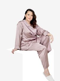 A woman dressed in Dusty Lilac Premium Satin Pyjamas