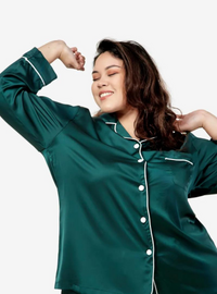 A woman dressed in Emerald Green Premium Satin Pyjamas