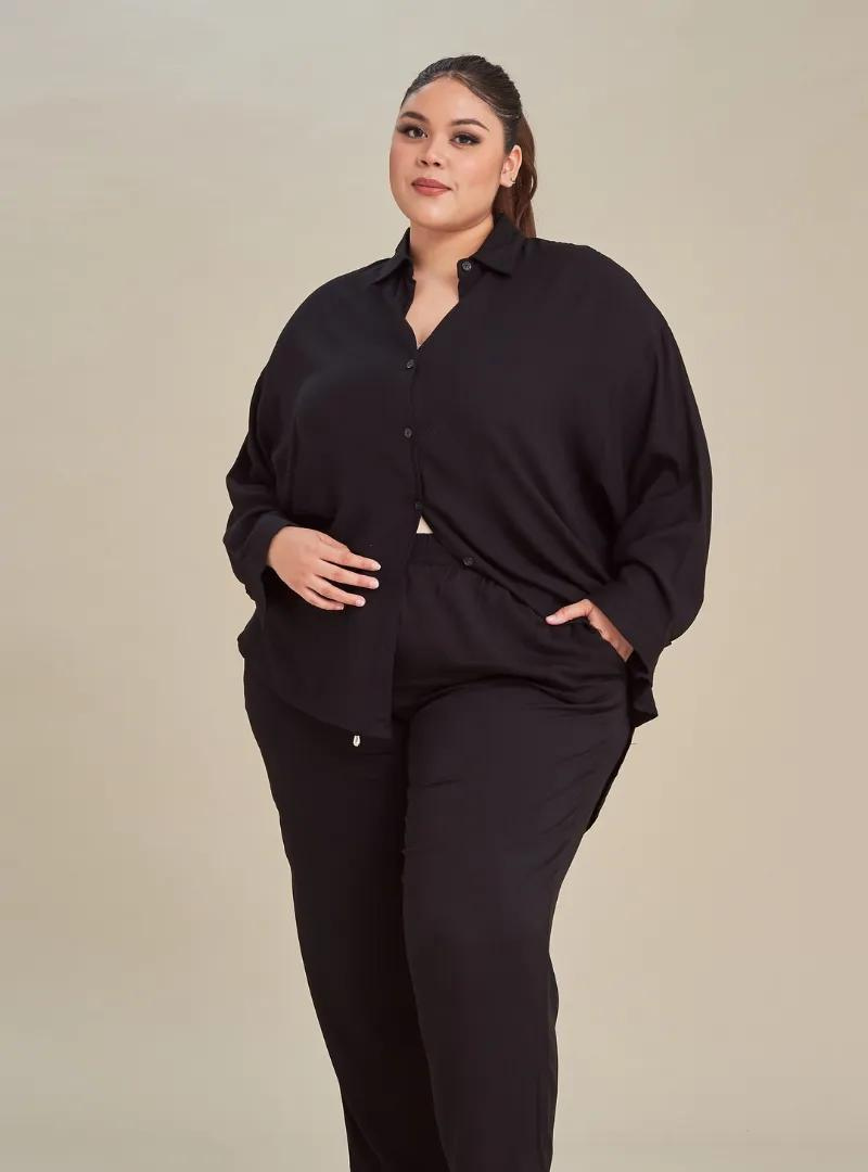 A woman dressed in All Black Printed Rayon Oversized Shirt