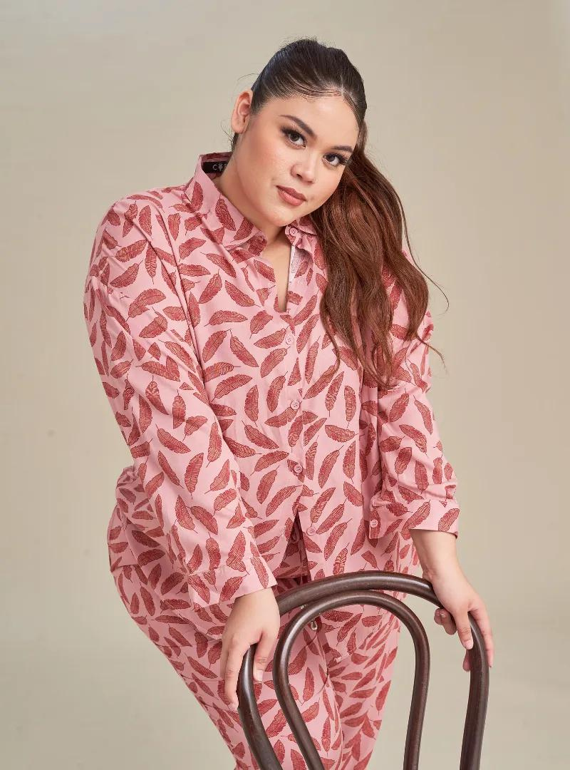 A woman dressed in Pink Leaves Printed Rayon Oversized Shirt