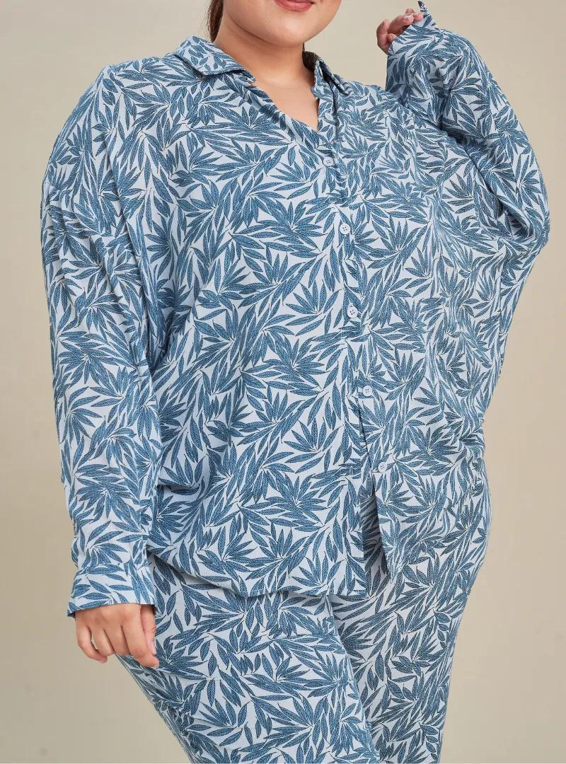 A woman dressed in Tropical Blue Printed Rayon Oversized Shirt