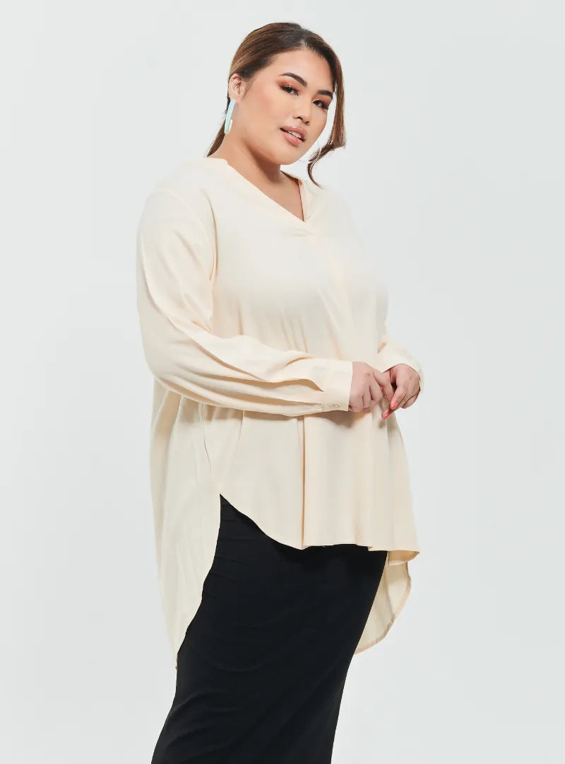 A woman dressed in Rice Mandarin Collar Oversized Shirt